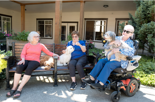 Group of seniors conversing in a courtyard